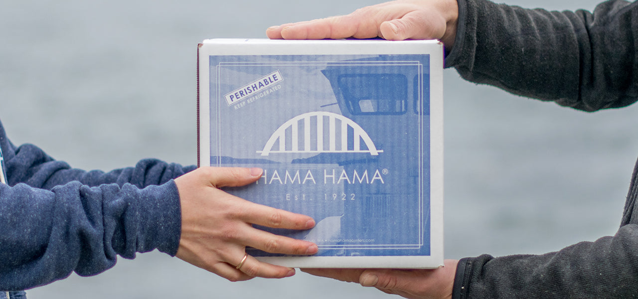 up close image of two sets of hands holding a shipping box