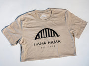 a silhouette of the tan Hama Hama Oyster Company bridge logo tee shirt in a folded position